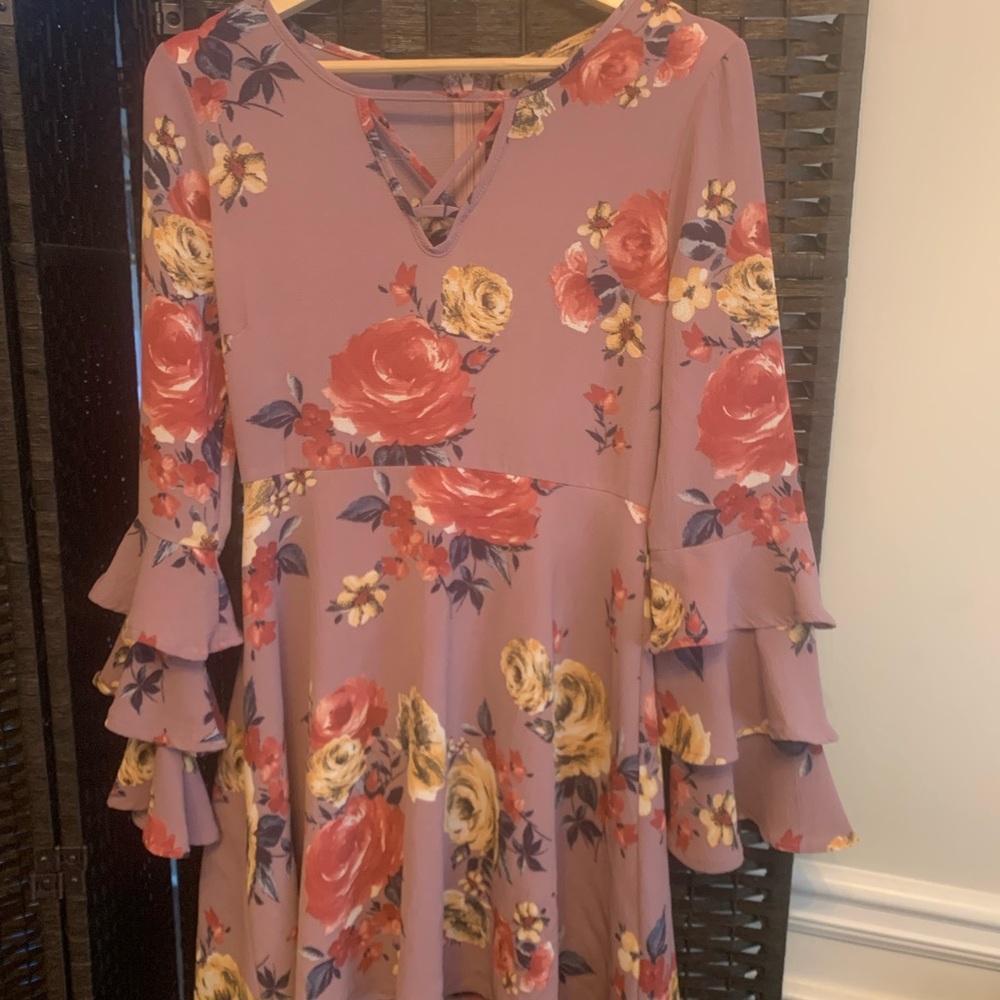 Top with flowers mid hip to top thigh length